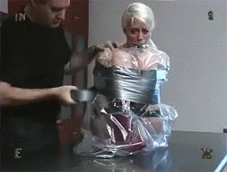 Master wraps duct tape around sub's body
